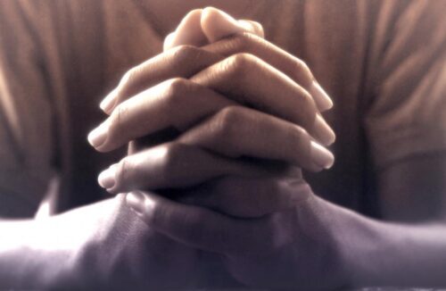 praying hands person praying faith prayer e1632322526446